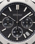 Luxury watch with black dial and silver case