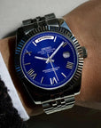 Blue Roman dial day date watch with silver band