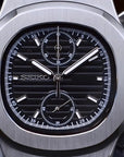 Silver Seiko watch with black face on a dark background