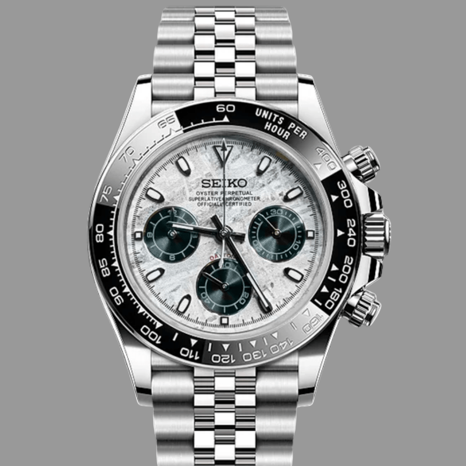 Silver Seiko meteorite chronograph watch with black bezel and jubilee bracelet on a white background