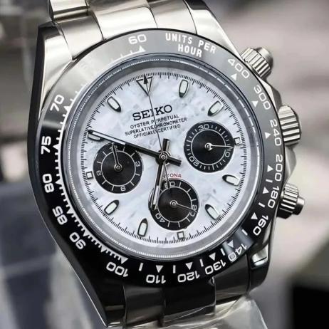 Custom Seikonaut meteorite watch mod with a detailed face on a reflective surface