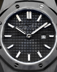Luxury ladies watch with a black face and silver case on a dark background