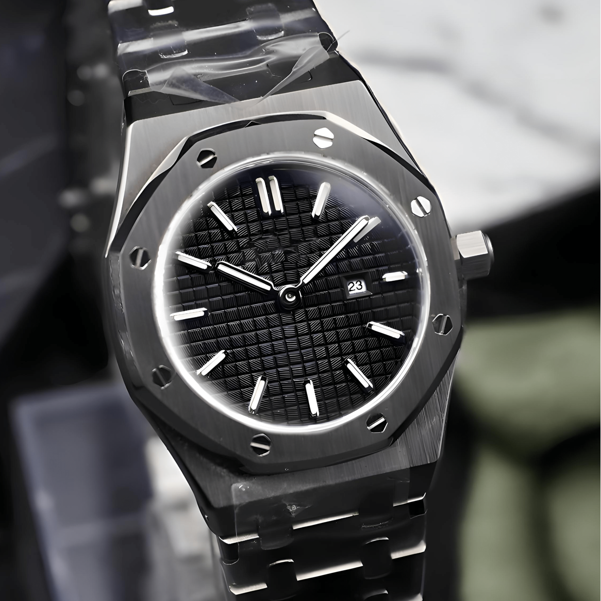Luxury watch with a black face and silver case on a stand