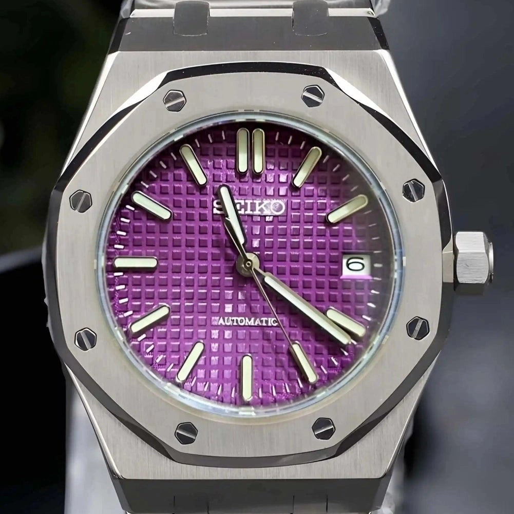 Watch with purple face and silver case on a clear stand