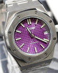Watch with a purple face and silver case on a blurred background