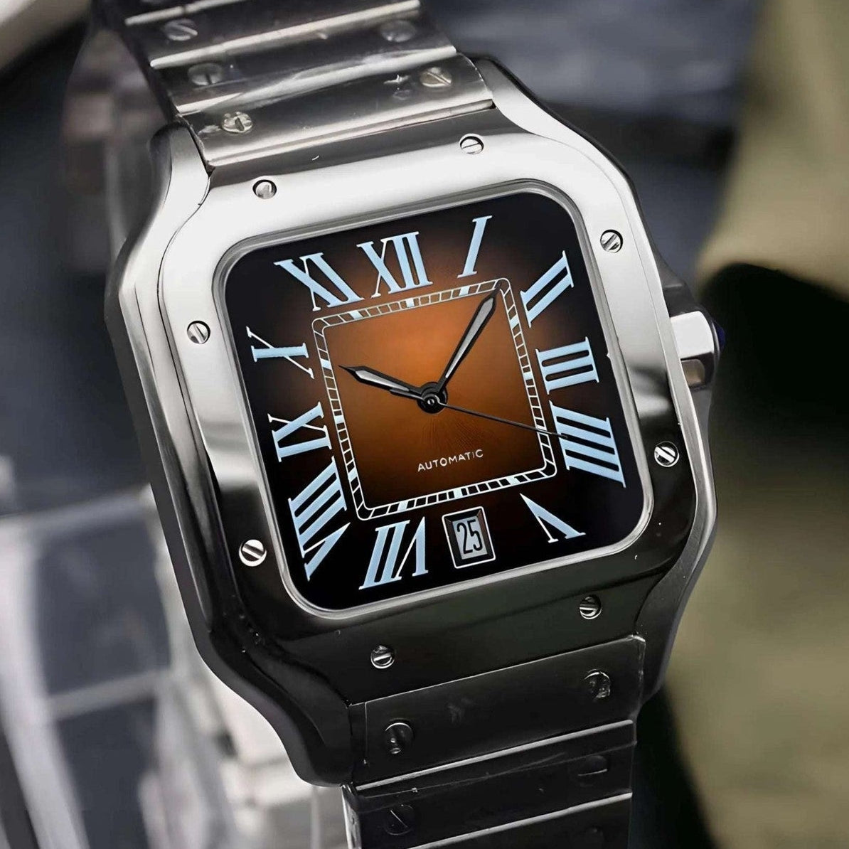 Silver watch with brown face on a stand