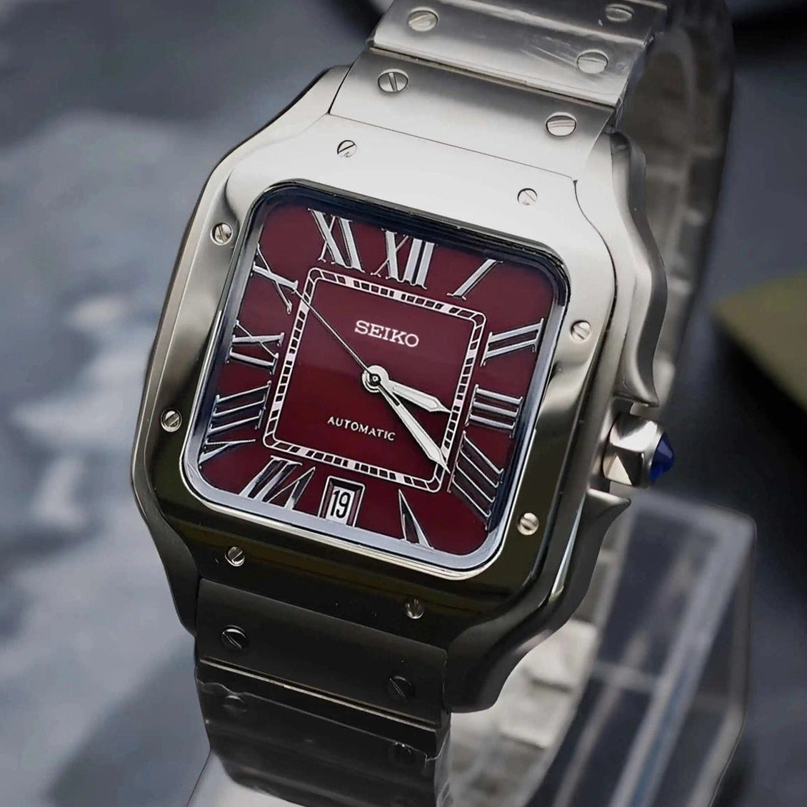 Santos mod watch with burgundy dial and stainless steel case