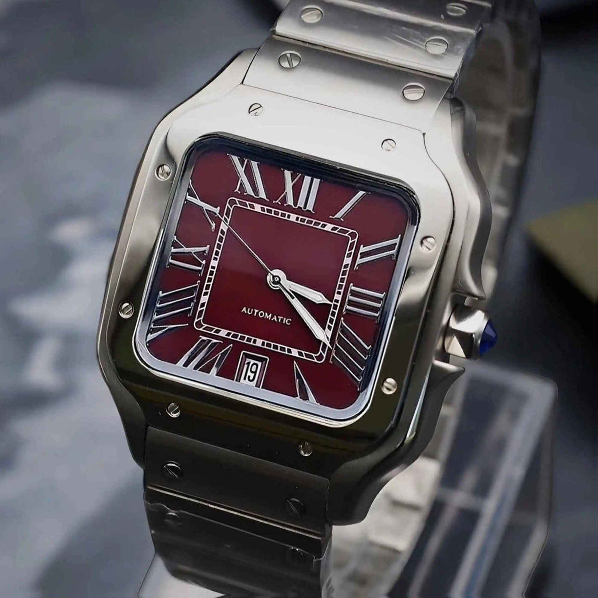 Santos mod watch with burgundy dial and stainless steel case