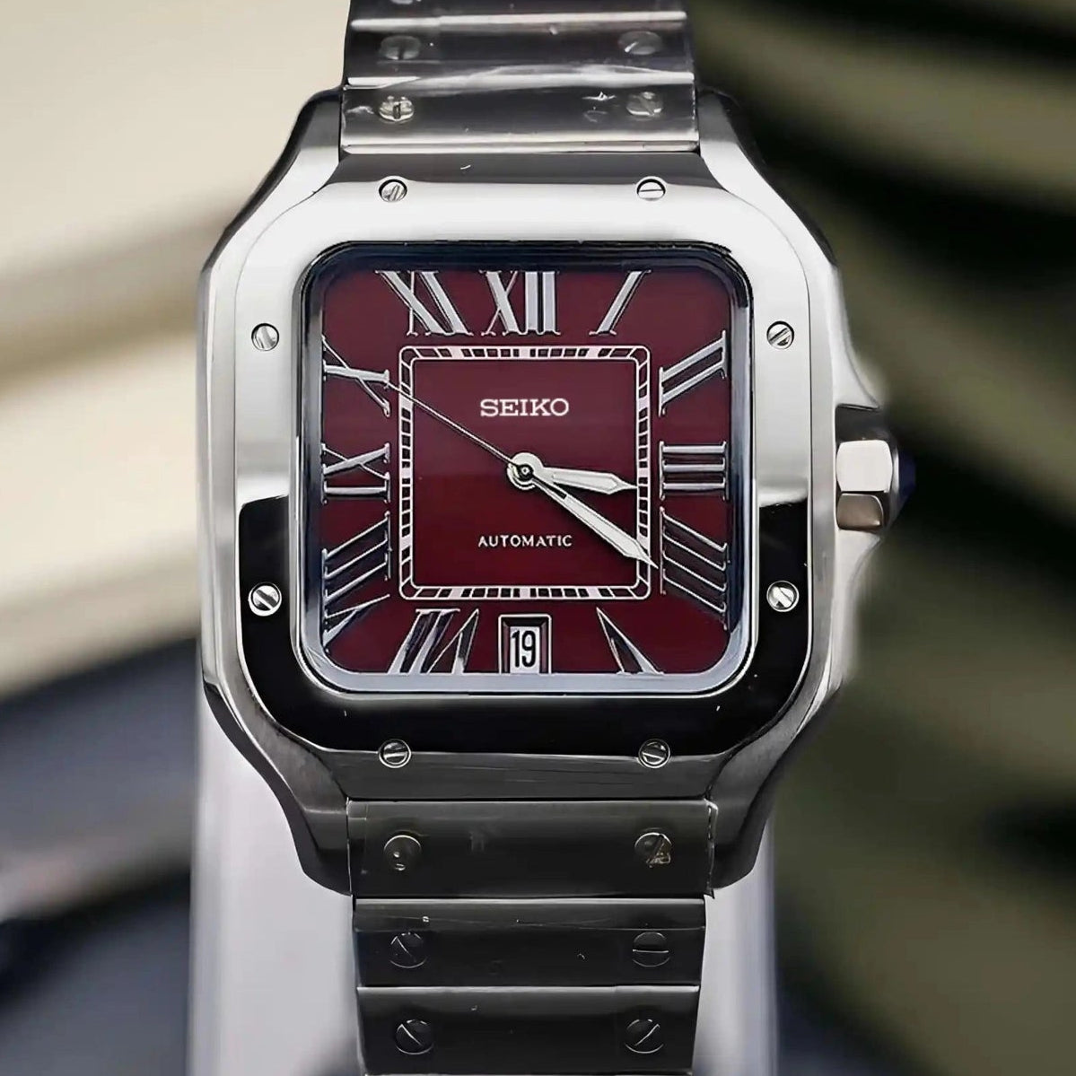 Santos mod watch with burgundy dial and stainless steel case