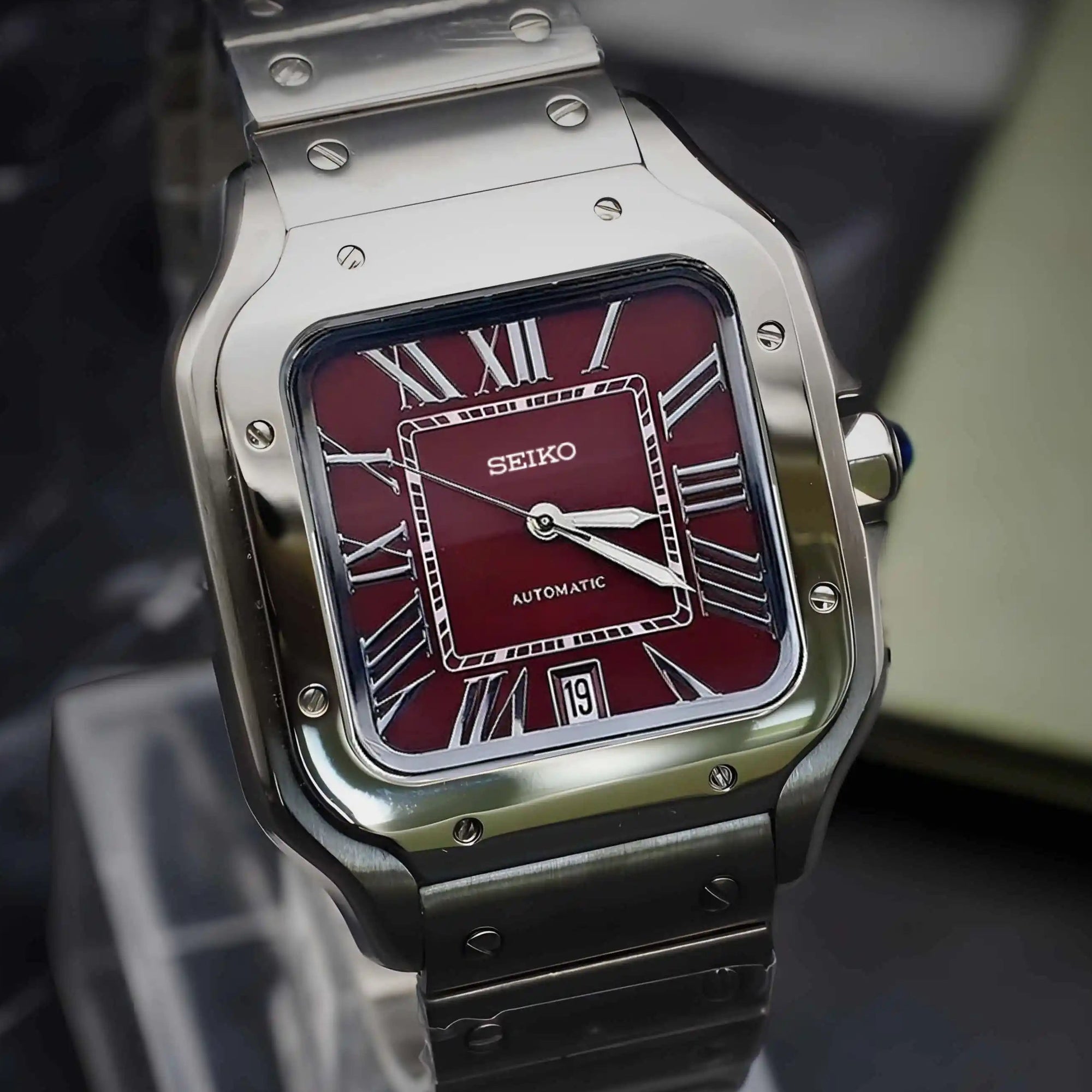 Santos mod watch with burgundy dial and stainless steel case