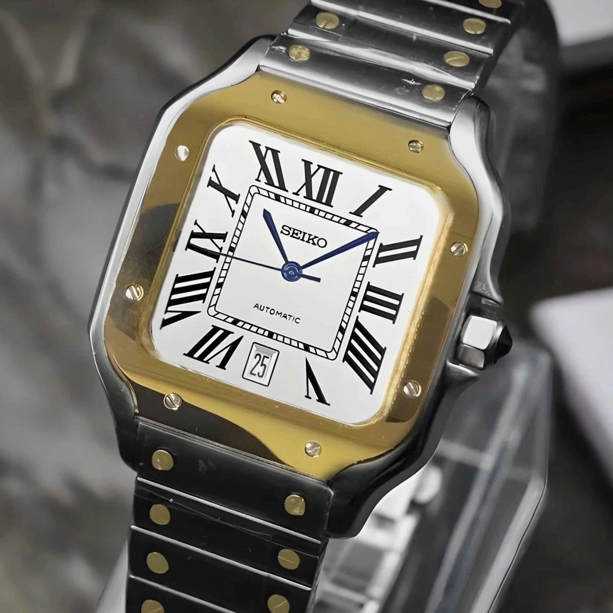 Santos mod watch with two tone gold dial and stainless steel case