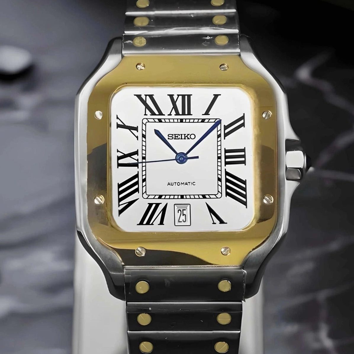 Santos mod watch with two tone gold dial and stainless steel case