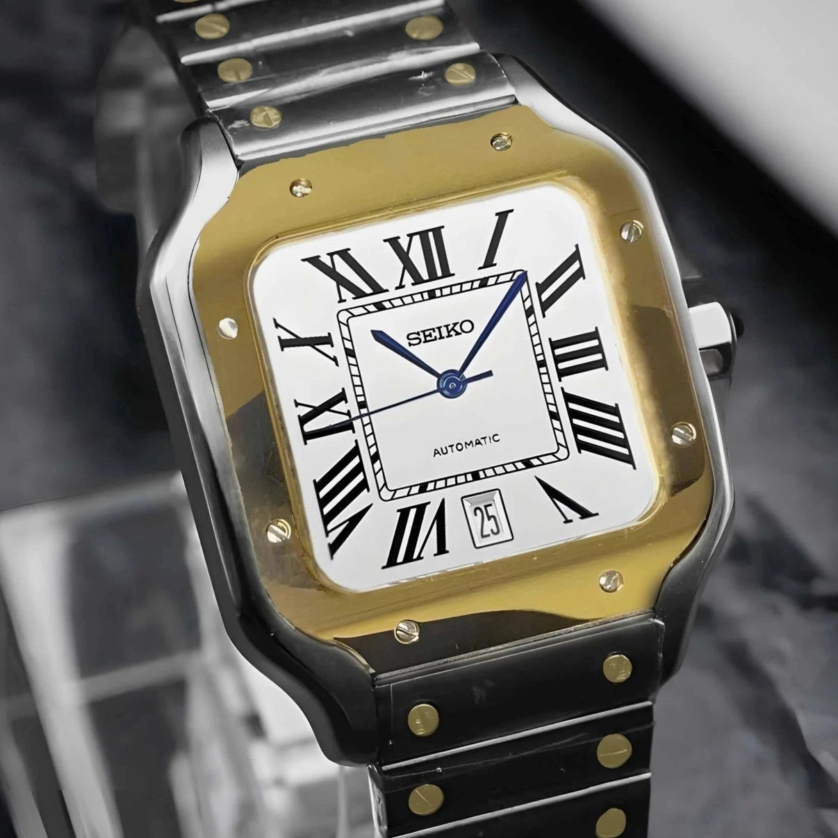 Santos mod watch with two tone gold dial and stainless steel case