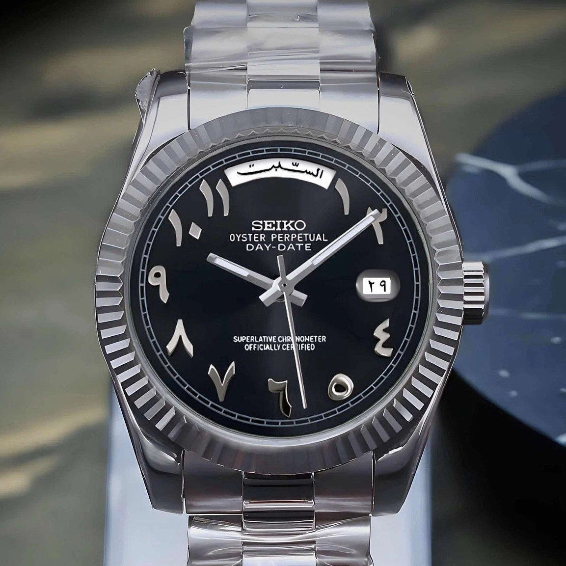 Black Arabic Seiko day-date mod with fluted bezel and jubilee bracelet