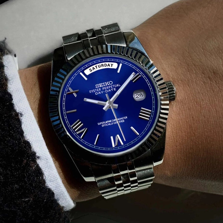 Blue Roman dial day date watch with silver band