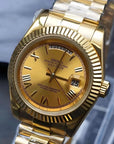 Day date Gold dial watch with gold band