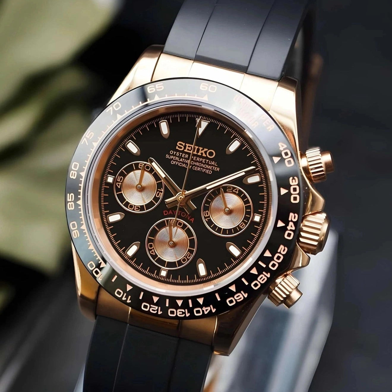 Seiko watch with black and rose gold design on a dark background